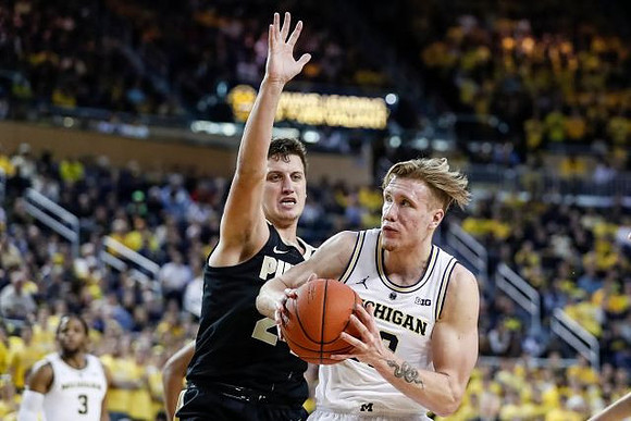 Zavier Simpson (3) and Ignas Brazdeikis (13)