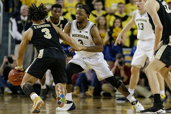 Zavier Simpson (3) and Ignas Brazdeikis (13)