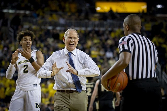 Jordan Poole (2) and John Beilein