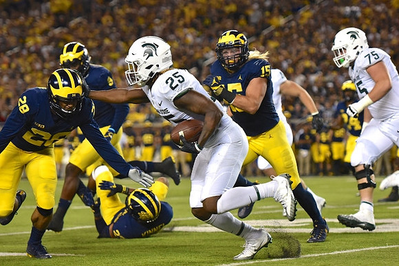 Brandon Watson (28), Mike McCray (9), Tyree Kinnel (23), Chase Winovich (15), and Lavert Hill (24)