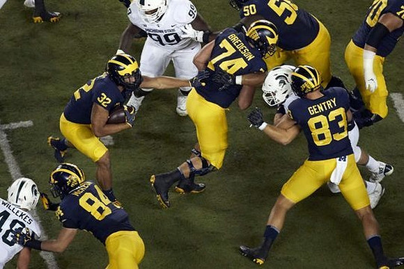 Sean McKeon (84), Ty Isaac (32), Ben Bredeson (74), Michael Onwenu (50), Zach Gentry (83), and Nolan Ulizio (70)