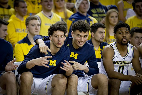 Brandon Johns Jr. (23), Adrien Nunez (5), and David DeJulius (0)