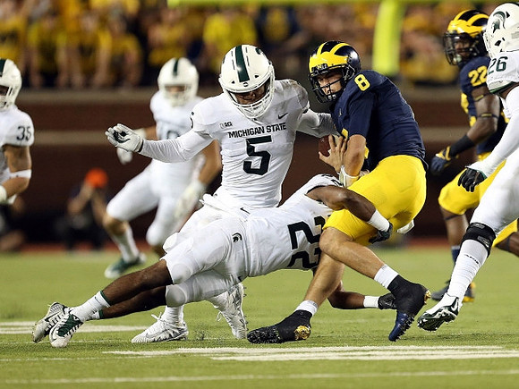 John O'Korn (8) and Karan Higdon (22)