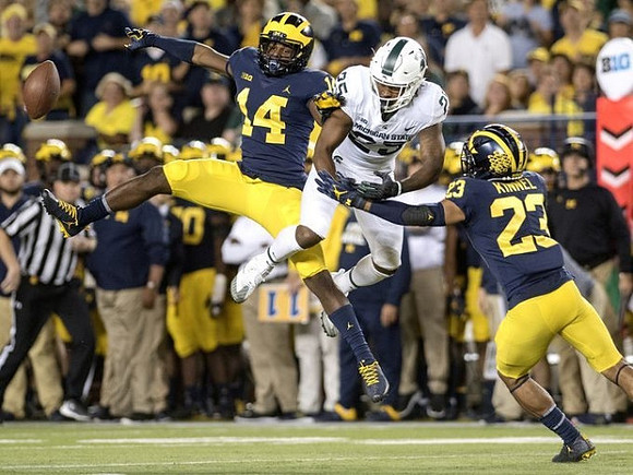 Josh Metellus (14) and Tyree Kinnel (23)