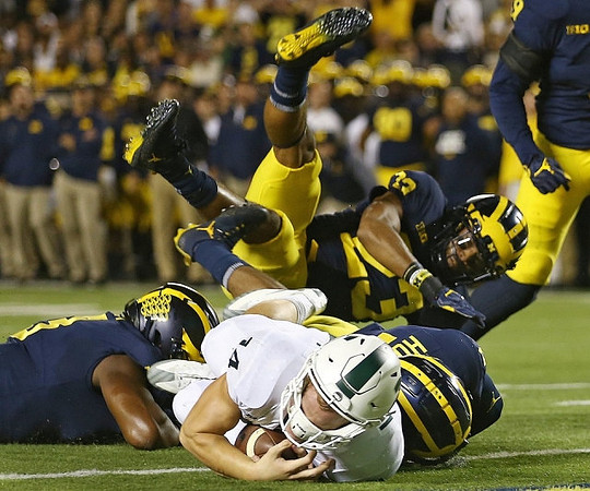 Tyree Kinnel (23) and Khaleke Hudson (7)
