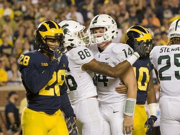 Brandon Watson (28) and Devin Bush (10)