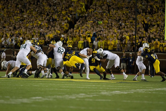 Tyree Kinnel (23), Mike McCray (9), and Devin Bush (10)