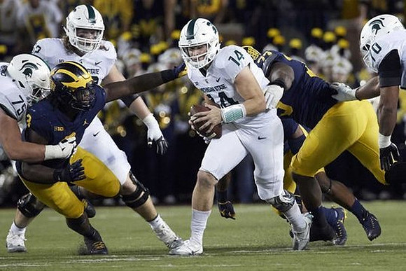 Rashan Gary (3) and Maurice Hurst (73)