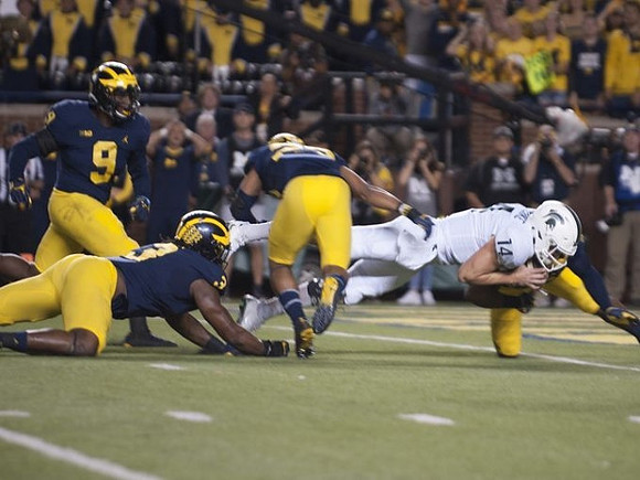 Mike McCray (9), Rashan Gary (3), and Tyree Kinnel (23)