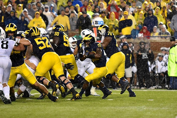 Zach Gentry (83), Mason Cole (52), Michael Onwenu (50), Karan Higdon (22), and Juwann Bushell-Beatty (76)