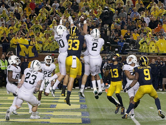 Zach Gentry (83), Eddie McDoom (13), and Donovan Peoples-Jones (9)