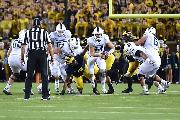 Rashan Gary (3) and Chase Winovich (15)