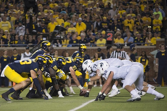 Zach Gentry (83), Michael Onwenu (50), Patrick Kugler (57), John O'Korn (8), and Donovan Peoples-Jones (9)