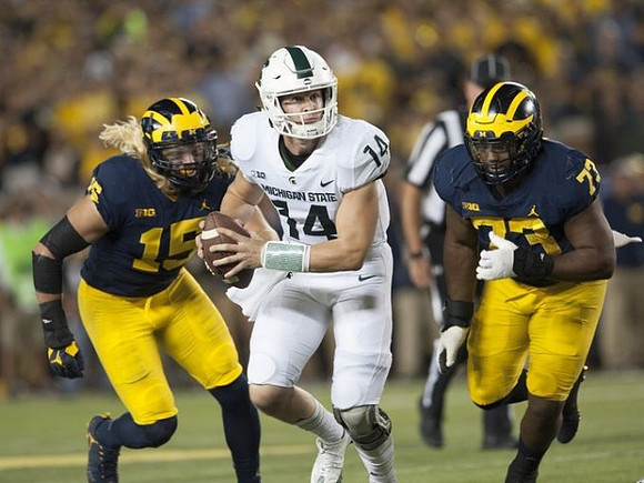 Chase Winovich (15) and Maurice Hurst (73)