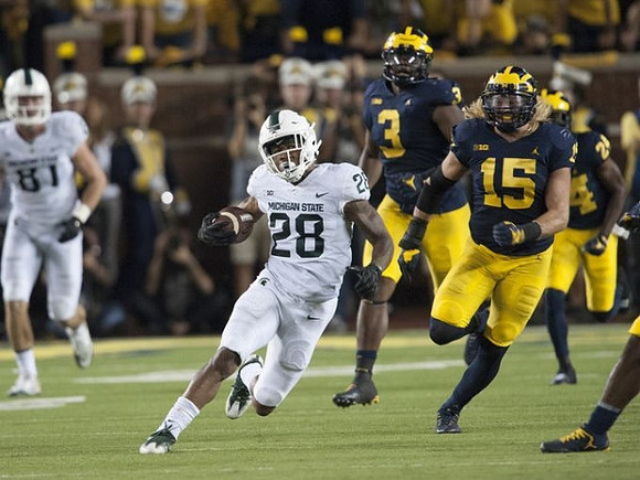 Rashan Gary (3), Chase Winovich (15), and Lavert Hill (24)