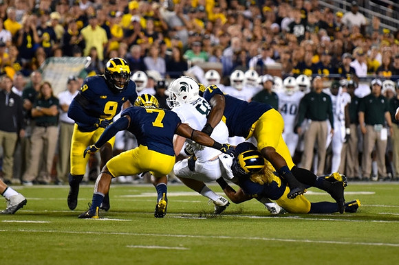 Mike McCray (9), Khaleke Hudson (7), Chase Winovich (15), and Maurice Hurst (73)
