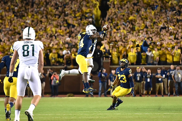 Khaleke Hudson (7), Josh Metellus (14), and Tyree Kinnel (23)