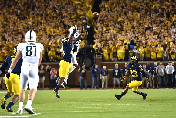 Khaleke Hudson (7), Josh Metellus (14), and Tyree Kinnel (23)