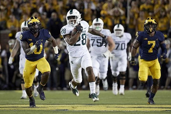 Devin Bush (10) and Khaleke Hudson (7)