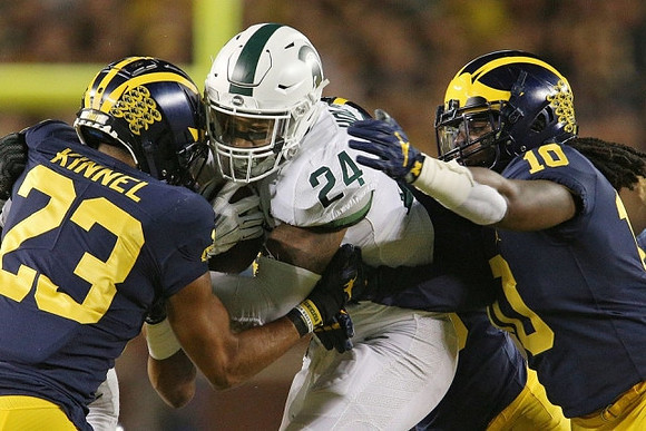 Tyree Kinnel (23) and Devin Bush (10)