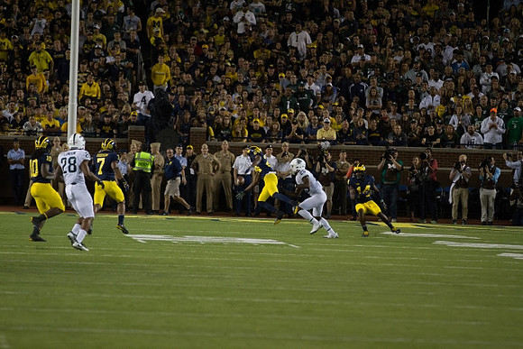 Devin Bush (10), Khaleke Hudson (7), Lavert Hill (24), and Josh Metellus (14)