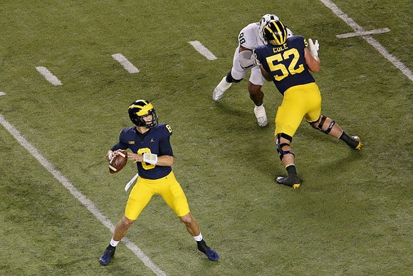 John O'Korn (8) and Mason Cole (52)