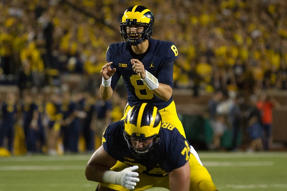 Ben Bredeson (74) and John O'Korn (8)