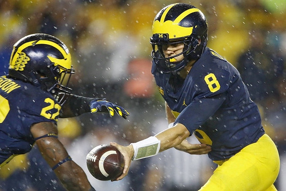 Karan Higdon (22) and John O'Korn (8)