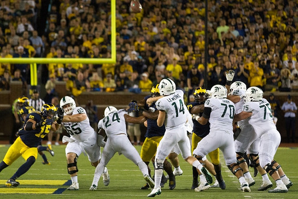 Chase Winovich (15), Rashan Gary (3), and Maurice Hurst (73)