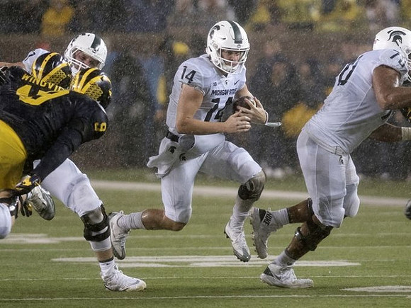 Chase Winovich (15) and Mike McCray (9)