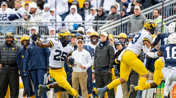 Hassan Haskins (25) and Erick All (83)