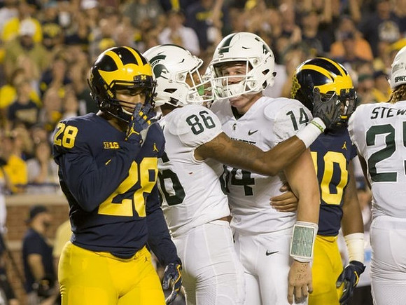 Brandon Watson (28) and Devin Bush (10)