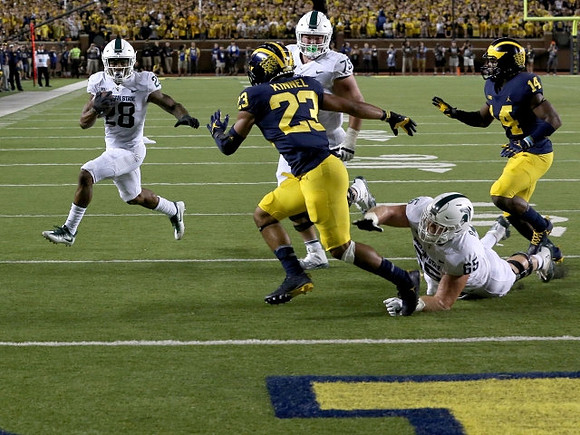 Tyree Kinnel (23) and Josh Metellus (14)