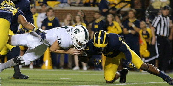 Tyree Kinnel (23) and Khaleke Hudson (7)
