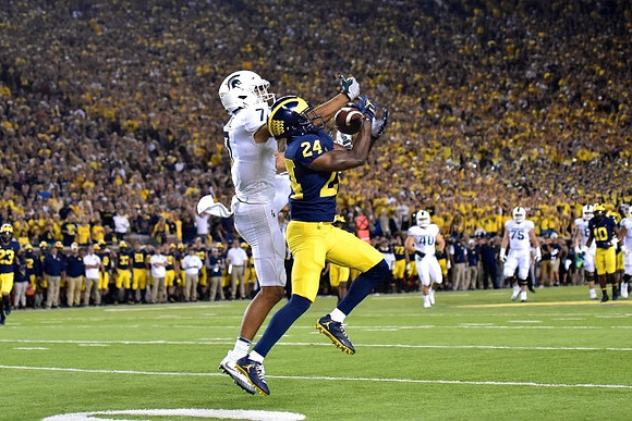 Lavert Hill (24), Tyree Kinnel (23), and Devin Bush (10)