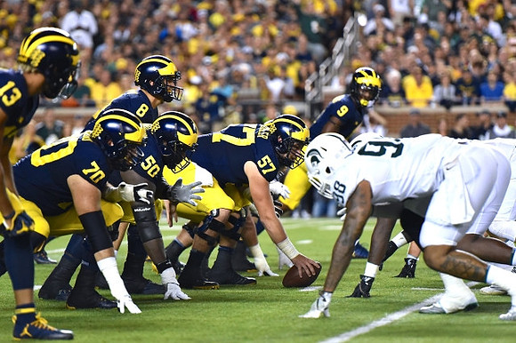 Eddie McDoom (13), Nolan Ulizio (70), John O'Korn (8), Michael Onwenu (50), Patrick Kugler (57), and Donovan Peoples-Jones (9)