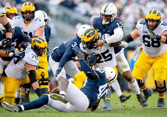 Ryan Hayes (76), Andrew Stueber (71), Hassan Haskins (25), and Andrew Vastardis (68)