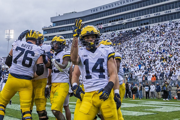 Ryan Hayes (76), Hassan Haskins (25), and Roman Wilson (14)