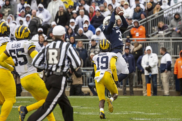 David Ojabo (55) and Rod Moore (19)