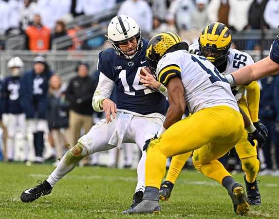 Josh Ross (12) and David Ojabo (55)