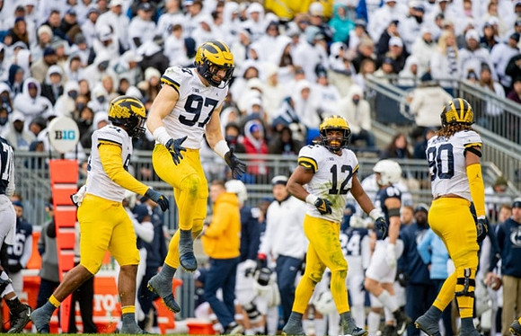 Taylor Upshaw (91), Aidan Hutchinson (97), Josh Ross (12), and Mike Morris (90)