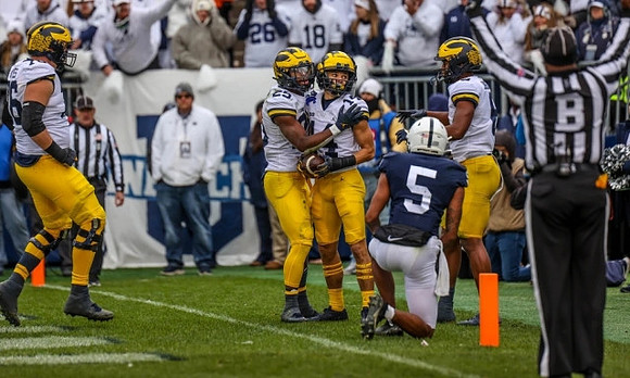 Ryan Hayes (76), Hassan Haskins (25), Roman Wilson (14), and Cornelius Johnson (6)