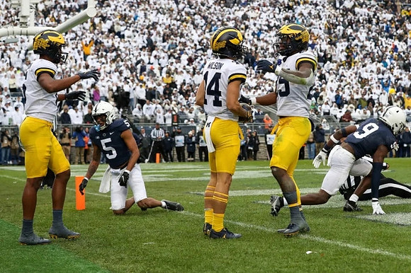 Cornelius Johnson (6), Roman Wilson (14), and Mike Sainristil (5)