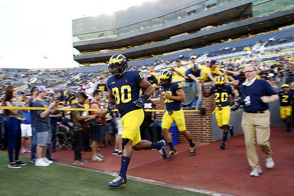Khalid Hill (80), Ty Isaac (32), and Tru Wilson (20)