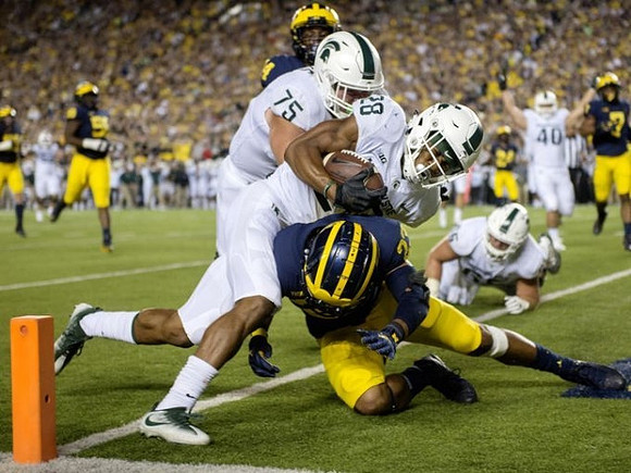 Tyree Kinnel (23) and Josh Metellus (14)