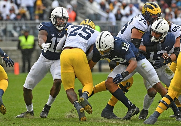 Hassan Haskins (25), Ryan Hayes (76), and Andrew Vastardis (68)