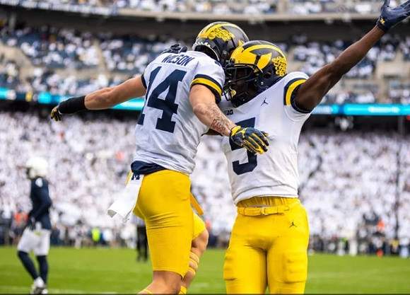 Roman Wilson (14) and Mike Sainristil (5)
