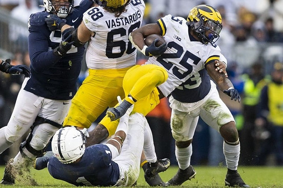 Andrew Vastardis (68) and Hassan Haskins (25)