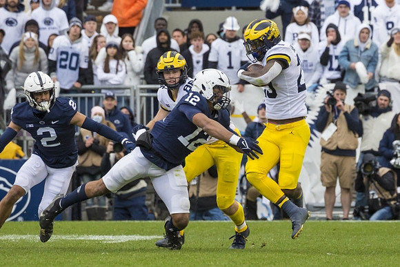 Luke Schoonmaker (86) and Hassan Haskins (25)