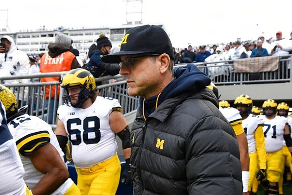 Josh Ross (12), Andrew Vastardis (68), and Jim Harbaugh